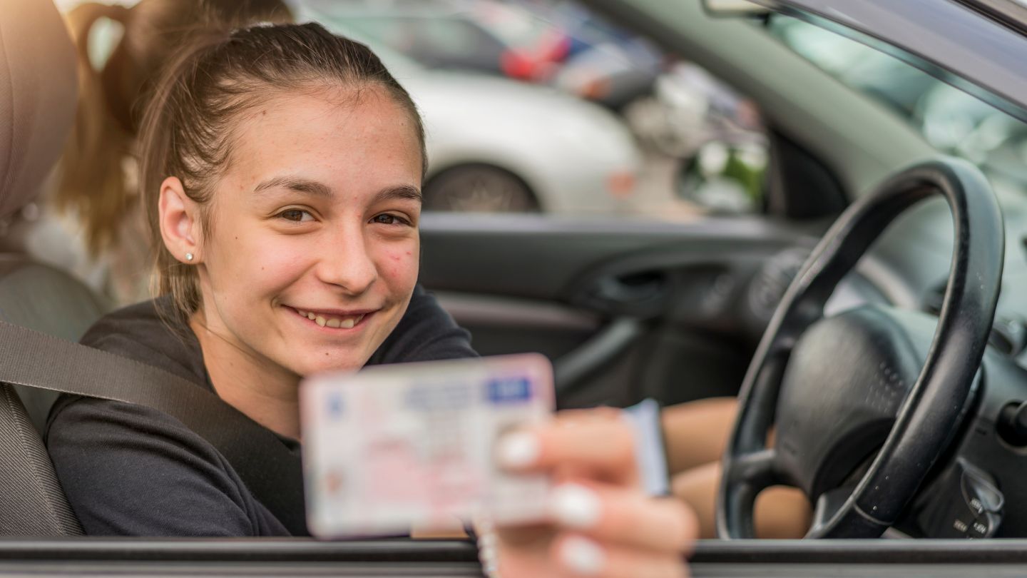 Teen Showing Off A New Driver’s License