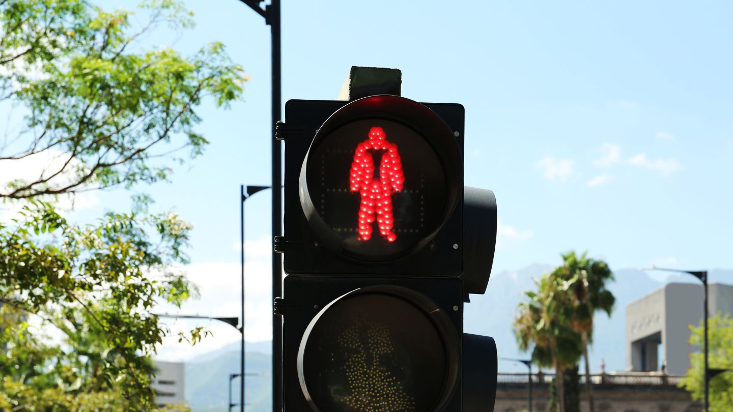 Red Pedestrian Signal At Traffic Light